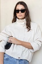 Load image into Gallery viewer, STORIES BE TOLD ENSEMBLE PUTTY FAUX LEATHER FUNNEL NECK ZIP THROUGH BOMBER JACKET
